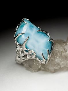 Silver ring with natural Larimar larimar origin - Dominican Republic stone measurements - 0.31 х 0.51 х 0.91 in / 8 х 13 х 23 mm ring weight - 11.64 grams ring size - 7 US ref No 8561 Worldwide shipping from Berlin, Germany. Prices include all taxes, valid in Germany and in European Union countries on the Customer's order date. Price does not include import taxes and custom duties. It is the Customer's full liability to pay any possible customs duties, import taxes or other applicable and due by the concerned country's regulations. Please ensure prior to a purchase that you know and understand payment requirements of rights as well as performance of any formalities resulting from their import or use applicable by your country's competent authorities and institutions. Turquoise Larimar Cabochon Jewelry, Unique Turquoise Larimar Gemstone Ring, Unique Turquoise Larimar Ring, Blue Larimar Opal Ring, Blue Larimar Gemstone Jewelry, Unique Blue Larimar Jewelry, Blue Larimar Jewelry For Anniversary, Blue Larimar Cabochon Rings, Larimar Gemstone Jewelry For Anniversary