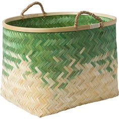 a green and white basket sitting on top of a table