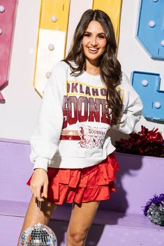 Get ready to show your love for the Sooners with this vintage sweatshirt! Perfect for cooler weather, this licensed grey sweatshirt can be worn while cheering on your team or just strolling around campus. Get yours now and show your team spirit! Model is wearing xs The University Of Oklahoma, University Of Mississippi, University Of Oklahoma, University Of Arkansas