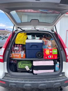 the back end of a car filled with food and drinks