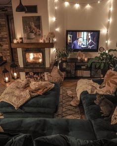 a living room filled with furniture and a flat screen tv sitting on top of a fireplace