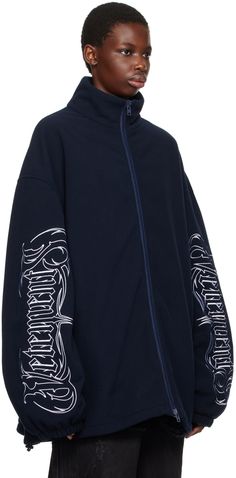 Polyester fleece jacket. · Funnel neck · Two-way zip closure · Zip pockets · Embroidered logo graphics at sleeves and back collar · Elasticized cuffs · Bungee-style pull-string at hem · Full mesh lining Supplier color: Navy Hooded Outerwear With Logo Detail For Streetwear, Hooded Streetwear Outerwear With Logo Detail, Long Sleeve Track Jacket With Logo Detail For Winter, Fall Track Jacket With Logo And Long Sleeves, Streetwear Long Sleeve Track Jacket With Embroidered Logo, Long Sleeve Track Jacket With Embroidered Logo For Streetwear, Fall Streetwear Outerwear With Logo Detail, Streetwear Sweatshirt With Zip Cuffs And Long Sleeves, Streetwear Long Sleeve Sweatshirt With Zip Cuffs