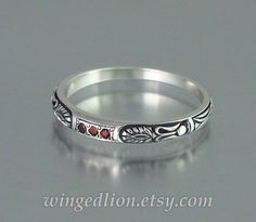 ALEXANDRA silver wedding band with garnets Byzantine Silver Jewelry For Weddings, Red Carved Jewelry For Wedding, Silver Stackable Ruby Ring For Wedding, Stackable Silver Ruby Ring For Wedding, Heirloom Silver Garnet Jewelry, Engraved Sterling Silver Ruby Ring For Wedding, Egyptian Ornamented, Silver Wedding Band, Silver Wedding Bands