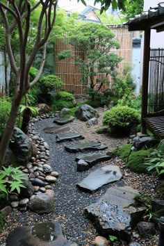 a garden with rocks and trees in it