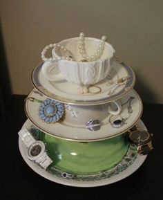 a stack of tea cups and saucers sitting on top of each other