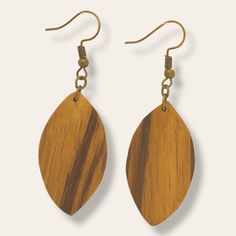 Our natural earthy zebrawood teardrop earrings are a classic shape and perfect for everyday wear or for a special evening out. We love the way the wood grain brings warmth and texture to this simple design. They're lightweight and dangle from brass earring hooks that keep them in place. Length: 2 1/2 inches with ear wires Materials: Reclaimed zebrawood, brass ear wires Unique Brown Teardrop Earrings, Brown Teardrop Wood Jewelry, Everyday Brown Wood Earrings, Artisan Brown Wooden Earrings, Unique Brown Wooden Earrings, Brass Earring, Zebra Wood, Earring Hooks, Brass Earrings