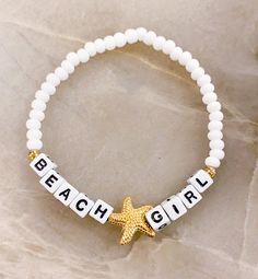 "Beach ⭐️Girl Bracelet  Sand. Salt. Sea. 18k gold filled starfish bead The perfect bracelet for the Beach Girl 🐚 Made with white 6mm seed beads, gold accents, gold starfish bead and 4mm (smaller) square letters that read \"BEACH GIRL\" If you would like another word or color, please put in Personalization Section* and we will message you if we have any questions.  CARING TIPS FOR YOUR JEWELRY ⭐️Treat and store with care. ⭐️ For longevity, avoid exposing your jewelry to water. ⭐️ Avoid having direct contact with lotions, perfumes, sanitizers as these chemicals may cause discoloration of your jewelry." Personalized Gold Friendship Bracelets For Beach, Adjustable Star Bracelets For The Beach, Letter Beads Bracelets For Beach Season Gifts, White Adjustable Name Bracelet For Beach, Adjustable Strand Bracelets With Letter Beads, Adjustable White Name Bracelet For Beach, Letter Beads Strand Bracelet For Gifts, White Strand Bracelet With Letter Beads, Adjustable White Star Charm Bracelet