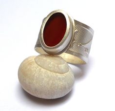 Carnelian Ring - beautiful sterling silver ring inlaid Carnelian gemstone. Egyptian paintings on the ring band in a matte finish. The Carnelian gemstone size is - 15/10 mm. The Ring will be packed in a Beautiful gift box. Free Shipping! Your item will be shipped via registered air mail with tracking number. Please contact me with any questions or requests. My Sterling Silver Hidden Seeds Collection at http://www.etsy.com/il-en/shop/NogaJewelry# Silver Rings With Polished Carnelian, Silver Carnelian Rings With Polished Finish, Silver Carnelian Ring Jewelry, Silver Carnelian Ring Stamped 925, Unique Silver Carnelian Rings, Silver Carnelian Wedding Rings, Egyptian Painting, Gold Earrings Wedding, Carnelian Ring