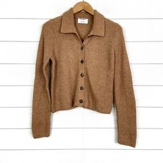 Brand: Old Navy Size: Medium Condition: Brand New, With Tag Attached Material: 56% Cotton, 25% Polyester, 16% Nylon, 3% Spandex Sosoft Collared Cardigan Sweater > Tan, Neutral (Belgian Waffle) > Long Sleeve > Button Front > Ribbed > Collared > Style 728882 Tags: Fall, Winter, Casual, Comfortable, Versatile, Comfy, Cozy, Cute, Trendy Measurements: Pit To Pit 20” (Measured Flat) Length 21.5” Fitted Casual Cardigan With Ribbed Collar, Fitted Long Sleeve Cardigan For Everyday, Classic Fall Cardigan With Ribbed Collar, Fitted Button-up Cardigan With Ribbed Collar, Cozy Collared Fall Sweater, Cozy Collared Winter Tops, Winter Soft Knit Button-up Tops, Cozy Fitted Button-up Sweater, Fitted Cozy Sweater With Button Closure