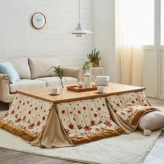 a living room with a couch, coffee table and rug