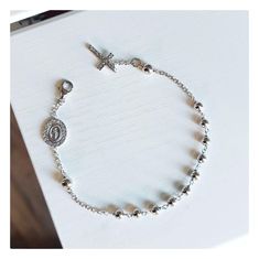 This beautiful rosary bracelet is made of sterling silver 925, with zircon cross and double sided Miraculous Medal encrusted with zircons. The specialty of this bracelet is in the fine details that make it perfect and shiny. This beautiful elegant bracelet is an ideal gift for catholic women on all occasions.  If you want to have a bracelet with a deeper meaning, this one is ideal for you Due to its simplicity, it can be worn every day and is easily combined with other jewelry. Item details:  Lenght of bracelet:  18 cm plus 1,5 cm  Width of bead :4  mm Weight of bracelet: 4,1 gr For any religious occasions. If you want to see the rest of our selection of beautiful bracelets, follow this link: https://www.etsy.com/shop/MedjugorjeJewelry?ref=shop_sections_curr&listing_id=1344945334§ion_id=40 Sterling Silver Spiritual Rosary Bracelet With Cross, Sterling Silver Cross Rosary Bracelet, Spiritual Sterling Silver Cross Rosary Bracelet, Elegant Sterling Silver Cross Rosary Bracelet, Silver Cross Rosary Bracelet, Silver Bracelet With Cross Pendant As Gift, Spiritual Silver Charm Bracelet With Cross, Spiritual Silver Cross Charm Bracelet, Elegant Silver Crucifix Rosary