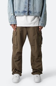 Articulated knees emphasize the baggy, relaxed fit of cargo pants that are cut from soft cotton and fitted with plenty of pockets for stowing a day's essentials. 32 1/2" inseam; 9 1/2" leg opening Zip fly Front pockets; back pockets; cargo flap-patch pockets 100% cotton Machine wash, tumble dry Imported Cotton Cargo Pants, Maternity Shops, Loungewear Shorts, Designer Clothes For Men, Denim Jumpsuit, Modern Outfits, Athletic Women, Sweater And Shorts, Autumn Fashion Women