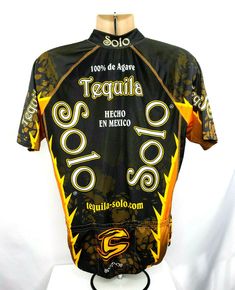 a black and yellow jersey with the words tegadia on it, sitting on top of a white mannequin