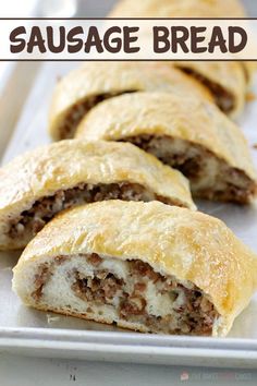 sausage bread is cut in half and ready to be eaten on a tray with text overlay