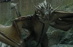 a large dragon with horns and spikes on its back