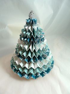 an origami christmas tree made out of folded paper