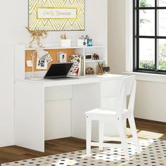 a white desk with a laptop computer on top of it next to a large window