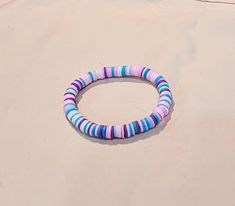 This bracelet is made of several fun colors!  Each bracelet will have it's very own random pattern. Multicolor Stretch Bracelet For Beach, Fun Purple Bracelets For Friendship, Trendy Multicolor Round Stretch Bracelet, Casual Purple Bracelets With Colorful Beads, Casual Purple Bracelets For Beach, Casual Purple Beach Bracelets, Handmade Purple Stretch Bracelet For Beach, Trendy Handmade Purple Wristband, Casual Purple Handmade Bracelets