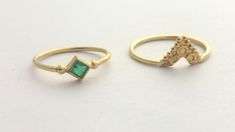 "A beautiful set of 2 matching 14k yellow gold rings, one of them with a green emerald. This set consists of two rings: one ring is 14K and a square natural green emerald ring, with two little gold dots at opposite corners, the other one is an ornamented ethnic triangle ring. The rings fit together perfectly and complement each other. This boho ring set is delicate and unique and will be a great choice for a special occasion gift or as an alternative and modern engagement ring. This set is light Gold Emerald Ring Stackable Fine Jewelry, Dainty Gold Emerald Cut Emerald Ring, Gold Stackable Diamond Ring, Gold Stackable Emerald Ring For Formal Occasions, Dainty Gold Ring With Emerald, Dainty Gold Rings With Emerald, Gold Stackable Emerald Ring, 14k Gold Stackable Emerald Cut Rings, Gold Stackable Emerald Ring For Wedding