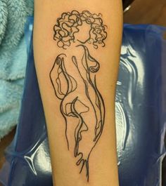 a woman's arm with a tattoo design on the left side of her body