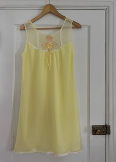 1970s yellow nightgown with floral embroidery 💐 Ruffled lace trim + bow 100% nylon Tag size L - est to fit M/L best but go by measurements below. Model is 5'2 34/27/38 for reference. Buyer is responsible for confirming fit and sales are final. If you have any questions please let me know before purchasing! CONDITION:  overall great vintage condition, a few faint pink spots on the back see pics MEASUREMENTS: (taken laying flat then doubled where applicable:) 36" long 36-38" pit to pit 38" waist Yellow Summer Nightgown For Sleep, Spring Yellow Nightgown For Loungewear, Yellow Summer Nightgown, 1970s Nightgown, Yellow Nightgown, Pastel Lingerie, Capsule Wardrobe Planning, Summer Yellow, Wardrobe Planning