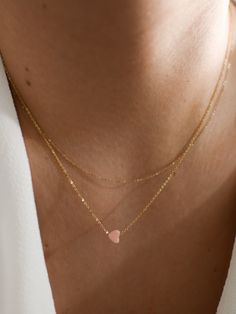 "𝗘𝗮𝘀𝘆 𝗧𝗼 𝗦𝘁𝘆𝗹𝗲, 𝗠𝗮𝗱𝗲 𝗧𝗼 𝗟𝗮𝘀𝘁 A perfect Valentine's Day gift, our dainty rose quartz gemstone necklaces are easy to layer and ready to be worn on repeat! Created to last a lifetime, these necklaces will remain evergreen even as the years and trends come and go. 𝗠𝗮𝘁𝗲𝗿𝗶𝗮𝗹𝘀 𝗪𝗲 𝗨𝘀𝗲 This necklace is made entirely with sturdy 14k yellow gold filled or sterling silver pieces and a genuine gemstone pendant. It is safe to wear in the shower, but we recommend avoiding pro Minimalist Gemstone Jewelry For Valentine's Day, Dainty Pink Gold Jewelry For Everyday, Dainty Rose Gold Heart Beads Necklace, Pink Double Strand Necklace For Gift, Dainty Pink Jewelry With Delicate Chain, Delicate Pink Heart Pendant Jewelry, Dainty Pink Jewelry With Heart Beads, Minimalist Gemstone Necklace For Valentine's Day, Pink Minimalist Jewelry As A Gift For Her