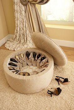 a round foot stool sitting on top of a rug next to a pair of shoes