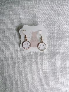 White Smiley Face Happy Smiles Earrings from Sassy Shortcake Boutique Trendy Adjustable Nickel-free Earrings, Trendy Nickel-free Drop Plug Earrings, Trendy Dangle Plug Earrings, Nickel Free, Trendy Nickel-free Dangle Plug Earrings, Trendy Adjustable Drop Plug Earrings, Trendy Adjustable Drop Earrings, Trendy Nickel-free Plug Earrings For Everyday, Novelty Everyday Dangle Earrings, Everyday Novelty Dangle Earrings