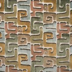 an area rug with various colors and shapes on the ground, including squares and rectangles