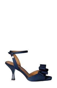 A voluminous bow accentuates the vamp of a lavish satin sandal set on a well-cushioned footbed and modern flare heel. 3" heel Memory foam cushioning Textile upper/synthetic lining and sole Imported Ankle Strap Heels With Bow, Synthetic, Synthetic Ankle Strap Heels With Bow, Synthetic Heels With Bow And Ankle Strap, Evening Sandals With Satin Bow And Round Toe, Formal Low Heel Sandals With Satin Bow, Glamorous Ankle Strap Sandals With Bow, Glamorous Sandals With Satin Bow, Evening Ankle Strap Sandals With Bow, Chic Sandals With Satin Bow For Events