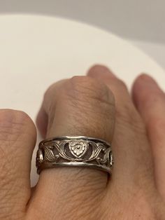 Vintage Wedding band or thumb ring. Size 8 925 Sterling Silver Tarnished with age 925 Sterling Filigree Setting Handmade Can be resized, my jeweler charges $10-$20 All rings are shipped free in the US in a nice gift box. Check out our over a THOUSAND great reviews!!! Engraving is $4 per letter and is not always perfect depending on the piece. It can take a few days if the jeweler is busy. This is payable to Paypal Judithsltd@gmail.com Etched Promise Ring Jewelry, Antique Engraved Ring With Decorative Band For Anniversary, Classic Engraved Band As Gift, Symbolic White Gold Rings For Anniversary, Antique Etched Ring Jewelry, Symbolic Wedding Jewelry With Intricate Design, Antique Etched Jewelry Ring, Sterling Silver Heirloom Jewelry For Promise, Heirloom Sterling Silver Promise Ring Jewelry