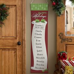 a christmas banner hanging on the wall next to a door