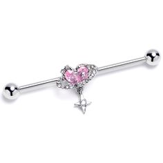 Product Details14 Gauge Pink Clear CZ Gem Starry Heart Dangle Industrial Barbell 38mm This 14 gauge helix barbell is out of this world. It is made with a 1 1/2 inch 316L surgical grade stainless steel straight barbell with 5mm ball ends. It features the planet Saturn, with the planet composed of a single heart shaped pink cubic zirconia gem and ring paved with clear cubic zirconia gems. Beneath the planet dangles a small star charm, set with a clear cubic zirconia gem for an added touch of style Heart Shaped Industrial Piercing, Pink Piercings, Industrial Piercing Aesthetic, Cute Industrial Piercing, Industrial Piercing Barbells, Pandora Bracelet Charms Ideas, Industrial Earrings, Industrial Piercing Jewelry, Types Of Ear Piercings