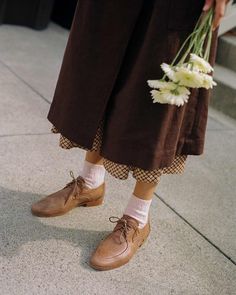 Lace-up vintage-inspired oxford Shoe made from dyed, untreated and naturally textured natural brown deadstock leather Leather sole made from upcycled deadstock Semi-pointed toe silhouette Brogue details Coated cloth cord laces Color variations may occur and look different from the photos! Available in whole sizes only - True-to-size for whole shoe sizes. If you are in-between sizes and have a narrow foot, we recommend you size down! If you have a wider foot, we recommend you size up! Handmade in Vintage Oxford Lace-up Shoes For Fall, Timeless Leather Lace-up Oxfords, Fitted Brown Lace-up Oxfords, Timeless Brown Oxford Lace-up Shoes, Brown Leather Lace-up Oxfords, Oxford Shoes Outfit, Brown Oxfords, Kei Visual, Saddle Leather