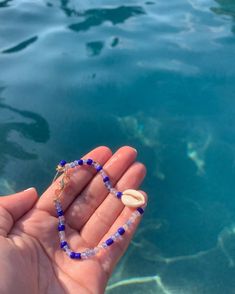 A fun blue bracelet with a sea shell attached Small Beads Bracelet, Sea Bracelet, Small Bead Bracelet, Sea Side, Small Beads, Beads Bracelet, A Sea, Blue Bracelet, Sea Shell