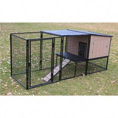 a large black dog house with a door open and a cat in it's cage