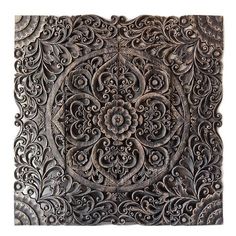 an intricately carved piece of metal