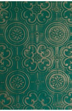 a green and gold wallpaper with ornate designs