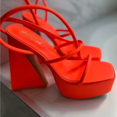 Women Chunky Strap Heels. Bold Ankle Strap Heels For Spring, Modern Orange Heels With Padded Heel, Orange Heels With Sculpted Heel For Spring, Bold Stacked Heel Party Heels, Bold Evening Heels With Wrapped Heel, Bold Sculpted Heel For Spring, Orange Heels With Heel Loop For Evening, Bold Block Heels With Padded Heel, Bold Heels With Stacked Block Heel