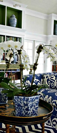 a living room with blue and white furniture