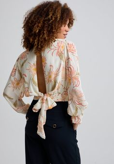 Our Maria blouse in the Moonflower print is a cut above the rest. An enchanting blouse with a bow and deep keyhole detail at the back making it effortlessly stylish. It features ruffle sleeve details adding an element of interest. The relaxed drapey fit makes it easy to tuck into your favourite pair of jeans or pair it with our Sophia Moonflower trousers.  Cool machine wash only. Wash inside out and with similar colours 100% Chiffon Viscose Sourced in India  Cool machine wash only. Wash inside out and with similar colours Cotton Nightwear, Bias Cut Skirt, Satin Trousers, Floral Pajamas, Luxury Scarves, Maxi Slip Dress, Moon Flower, Pearl Jewellery Earrings, Short Pajama Set