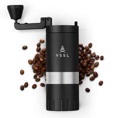 a coffee grinder surrounded by coffee beans