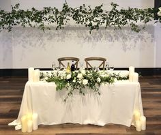 the table is set with candles and flowers