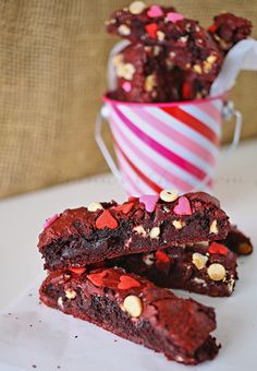 two pieces of chocolate brownie with red and white sprinkles