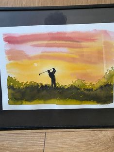 a watercolor painting of a man playing golf on a beautiful day with the sun setting