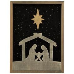 a nativity scene with a star above the manger and baby jesus in silhouette