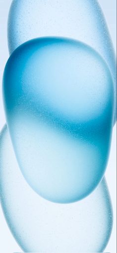 an abstract blue background with bubbles in the middle and one on the bottom, as if it were liquid or water