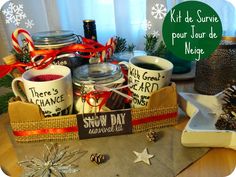 a table topped with mugs and christmas decorations