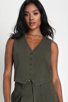 From SoHo to Spain, the Lulus Suits You Perfectly Olive Green Linen Vest is a stylish look that's sure to get you noticed! Lightweight, linen-blend fabric shapes this chic, vest-style top that has a functional five-button placket at front and finishes with cropped, angled hems. Pair with the matching pants for a complete look! Fit: This garment fits true to size. Length: Size medium measures 19.75" from shoulder to hem. Bust: Great for any cup size. Waist: Loosely Fitted. Undergarments: May be w Vest With Buttons, Green Tunic Dress, Olive Green Vest, Wrap Top Blouse, Linen Vest, Casual Formal Dresses, Neutral Tops, Olive Green Shorts, Vest Style