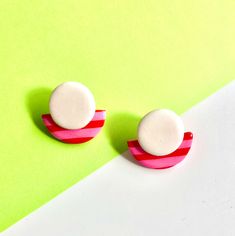 With only one pair made of each design, they're as unique as they are beautiful. Once it's gone, it's gone - so seize the chance to own a piece of exclusive pairs today! Introducing our "Candy Crush" earrings, reminiscent of delicious sweet treats with their red and pink half-circle geometric design accented by a charming white circle. These earrings evoke a playful and whimsical vibe, perfect for adding a pop of fun to your ensemble. The vibrant red and pink hues exude a sense of sweetness and Bold White Jewelry For Gift, Bold White Jewelry For Gifts, Bold Pink Jewelry For Gifts, Bold Polymer Clay Earrings For Gift, Bold Polymer Clay Earrings As Gift, Candy Red, White Circle, Rose Bonbon, Bold Jewelry